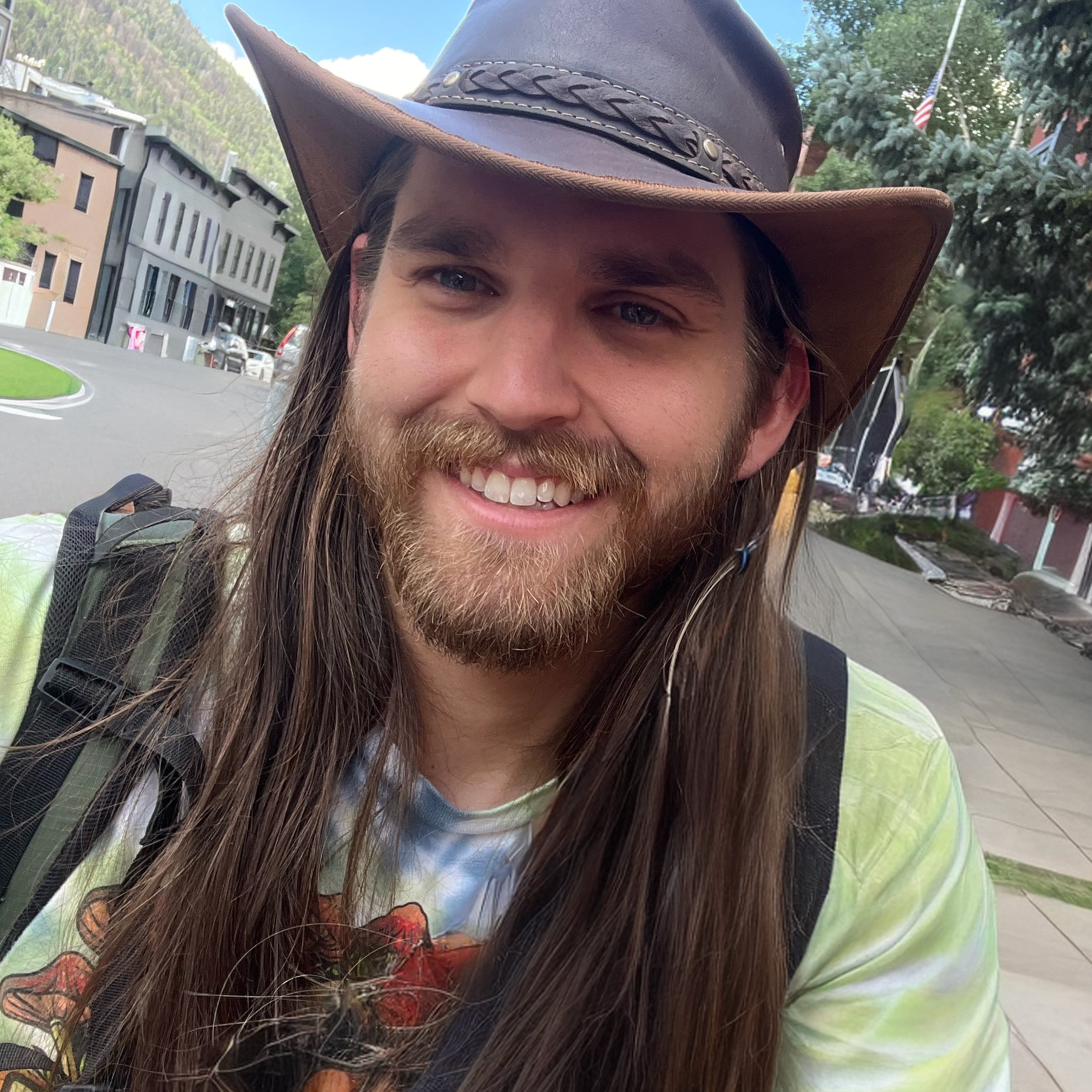 Biographical image of Chris wearing a brown hat